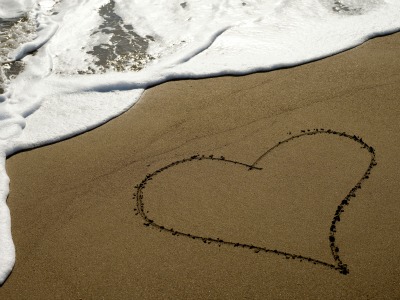heart drawn in beach sand